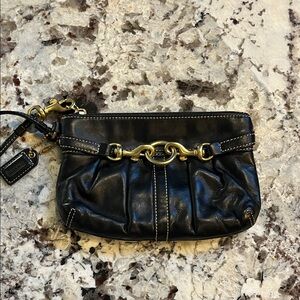 Coach Black leather wristlet. Pre-Owned Condition-Very Good.